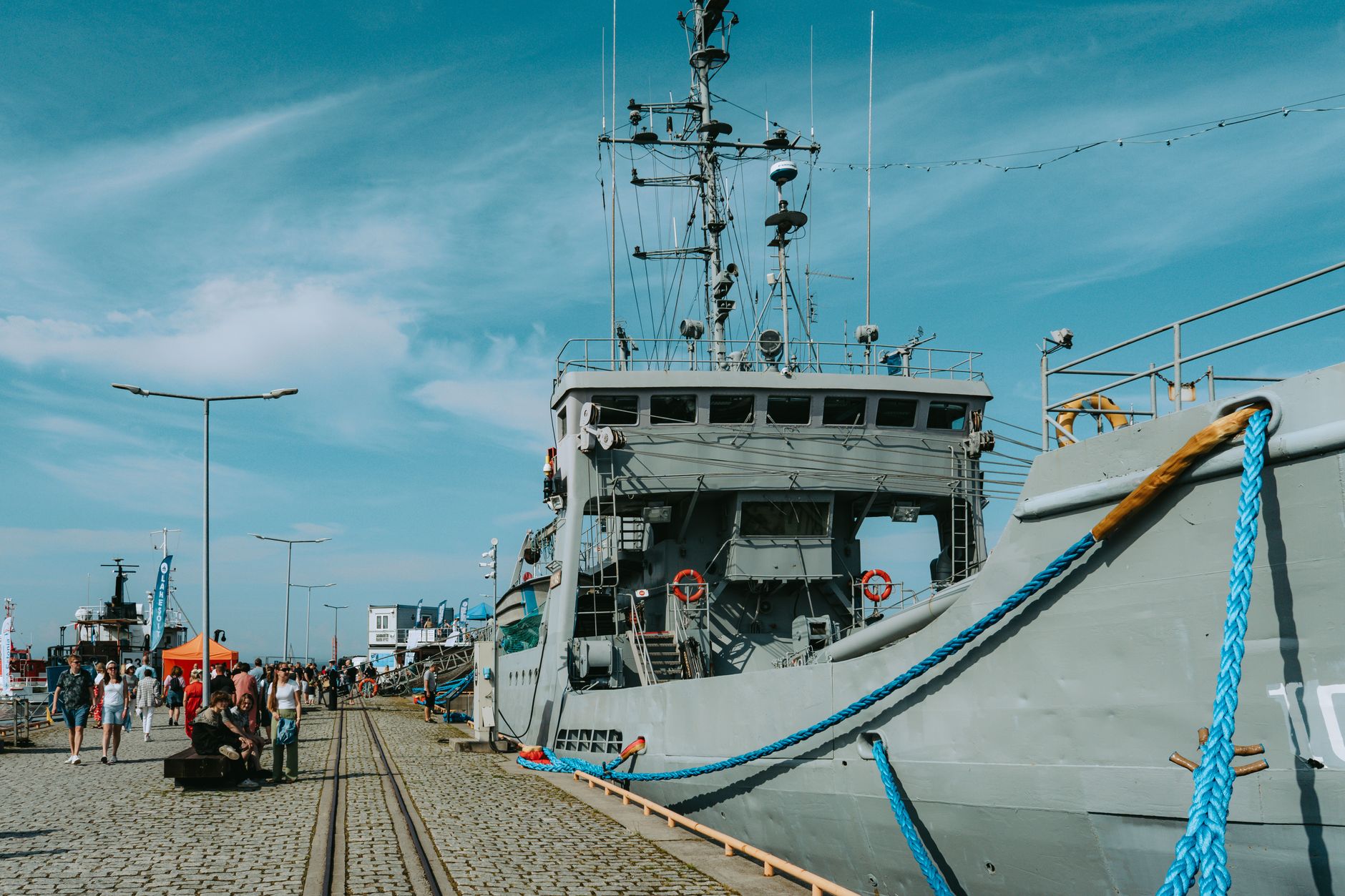 Scenic view of a historic ship docked at Tallinn's Seaplane Harbour during a summer maritime festival. — Trójmiasto