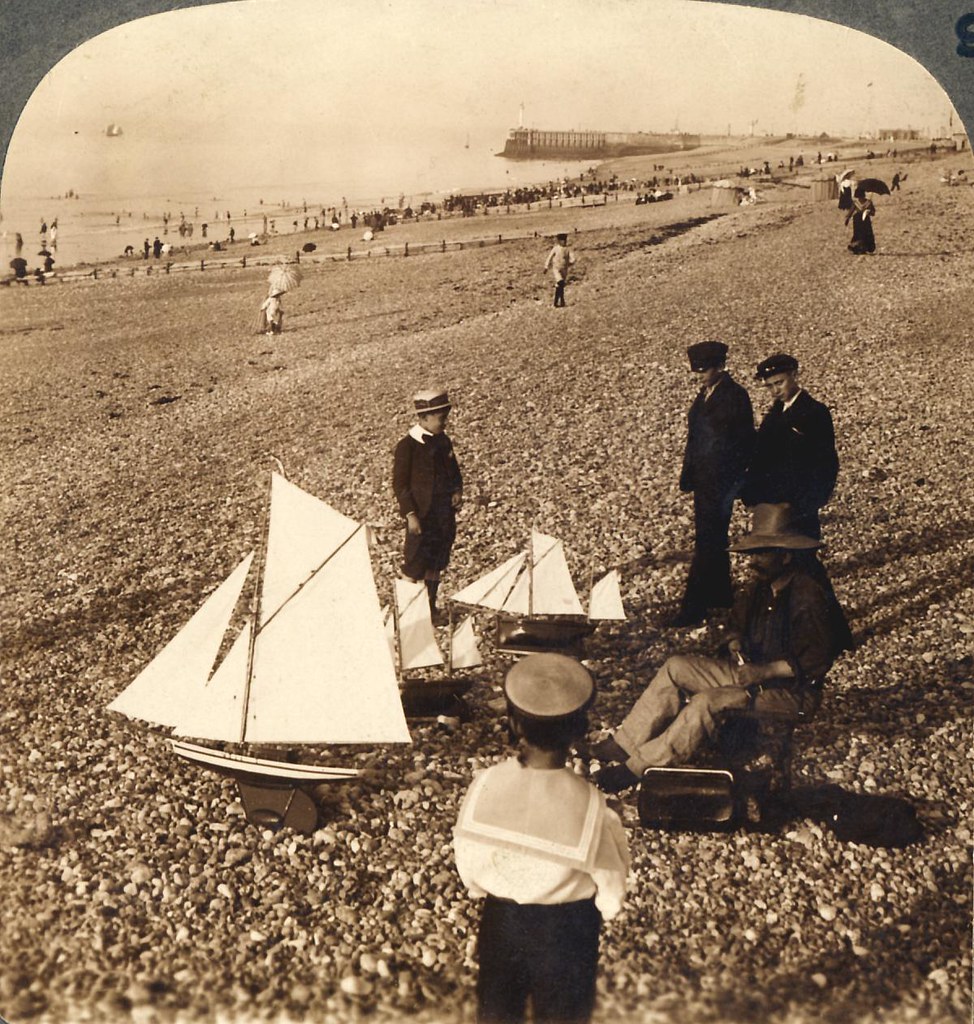 A boat builder and boy customers - E. along sea beach at Deippe, France - very early 1900s