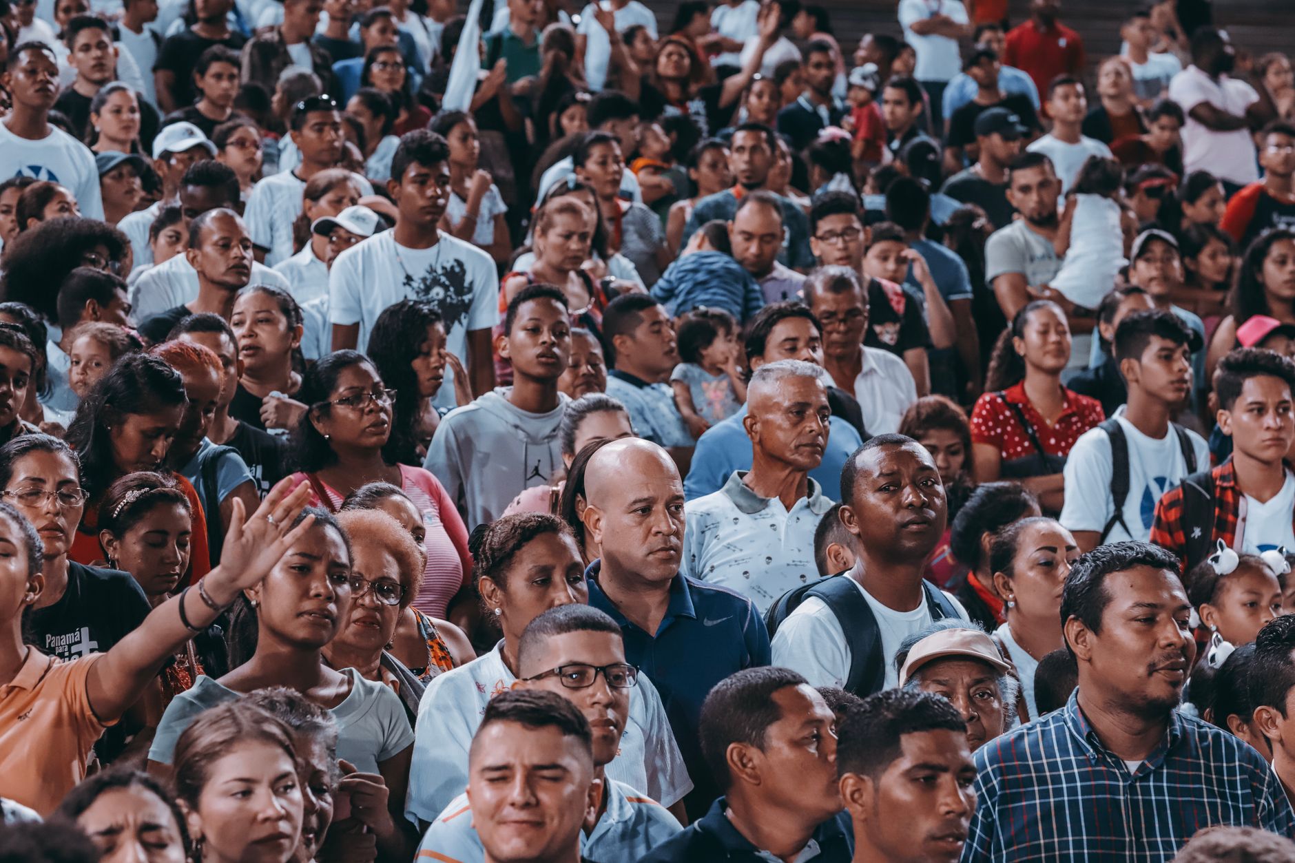 A large, diverse crowd gathers outdoor, showcasing unity and community spirit. — Trójmiasto