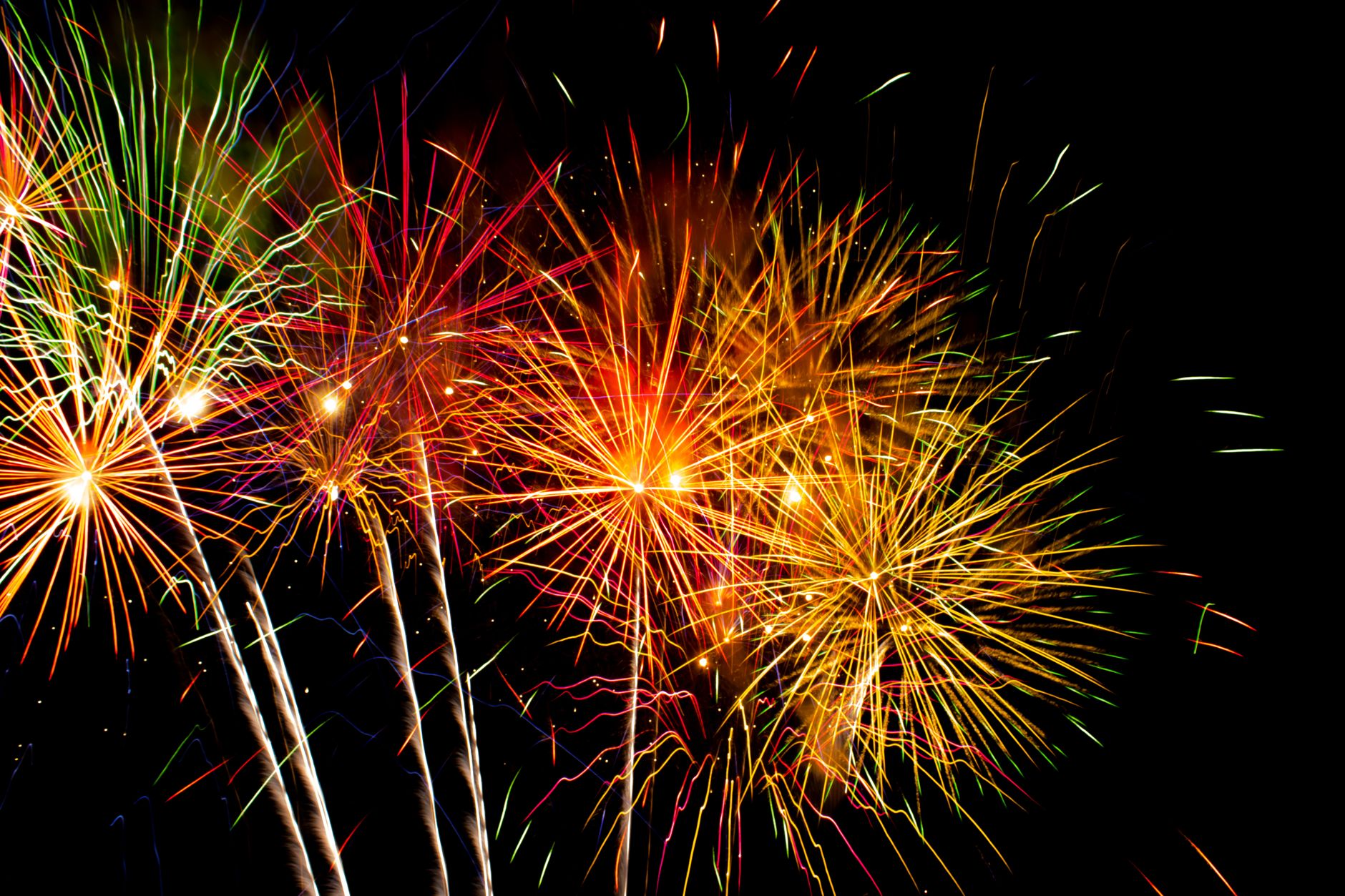Colorful fireworks explode in the night sky, creating a vivid display of light and color. — Trójmiasto