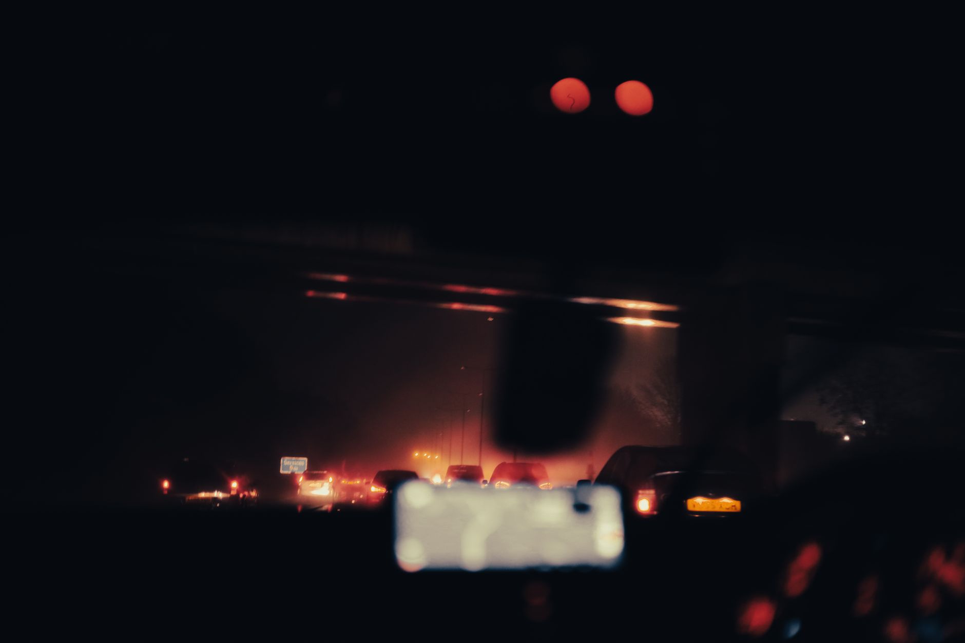 Blurred view of vehicles and car lights on a highway at night, creating a moody and illuminated atmosphere. — Trójmiasto