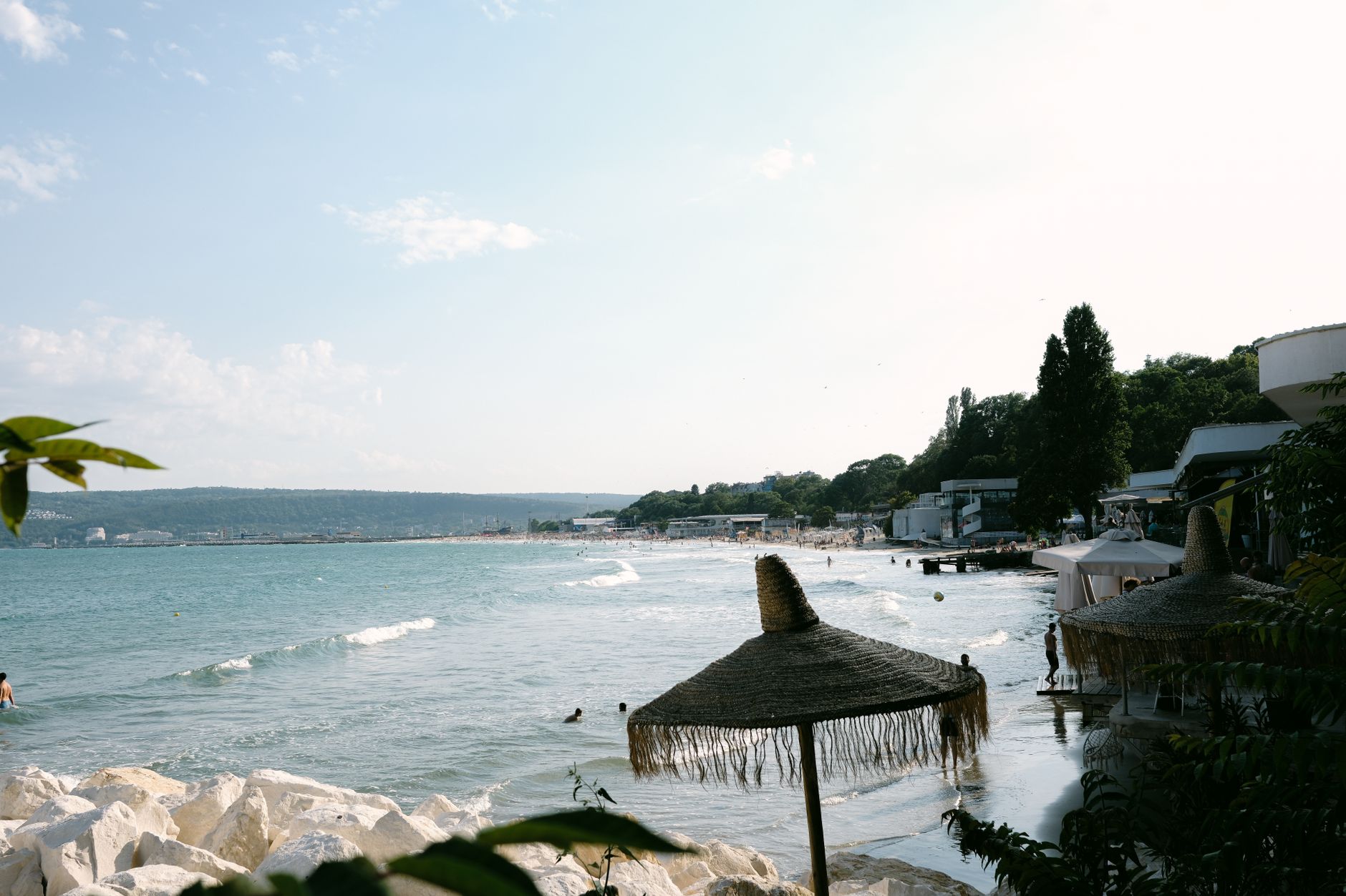 A tranquil beach scene in Bulgaria with umbrellas and clear waters, perfect for holiday relaxation. — Trójmiasto