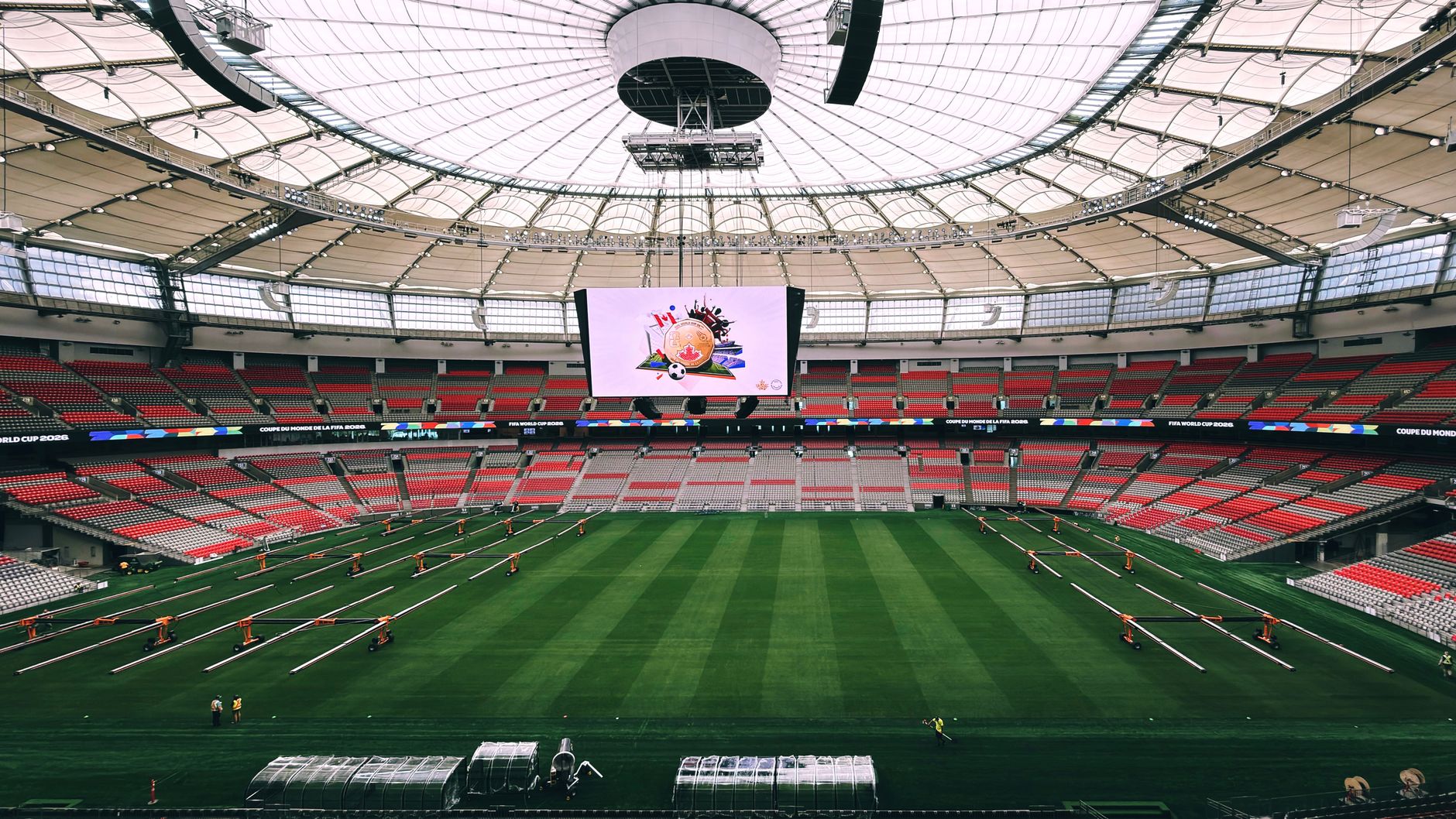 Interior view of BC Place Stadium in Vancouver, showcasing its vast seating and advanced roof structure. — Trójmiasto